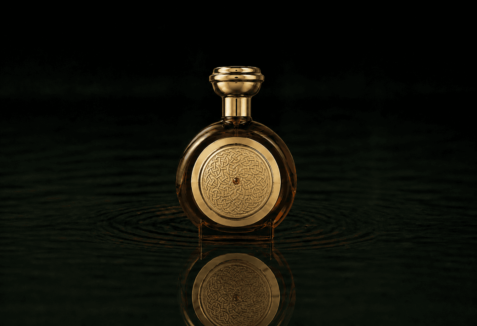 Boadicea The Victorious Tobacco Sapphire fragrance bottle floating above dark water