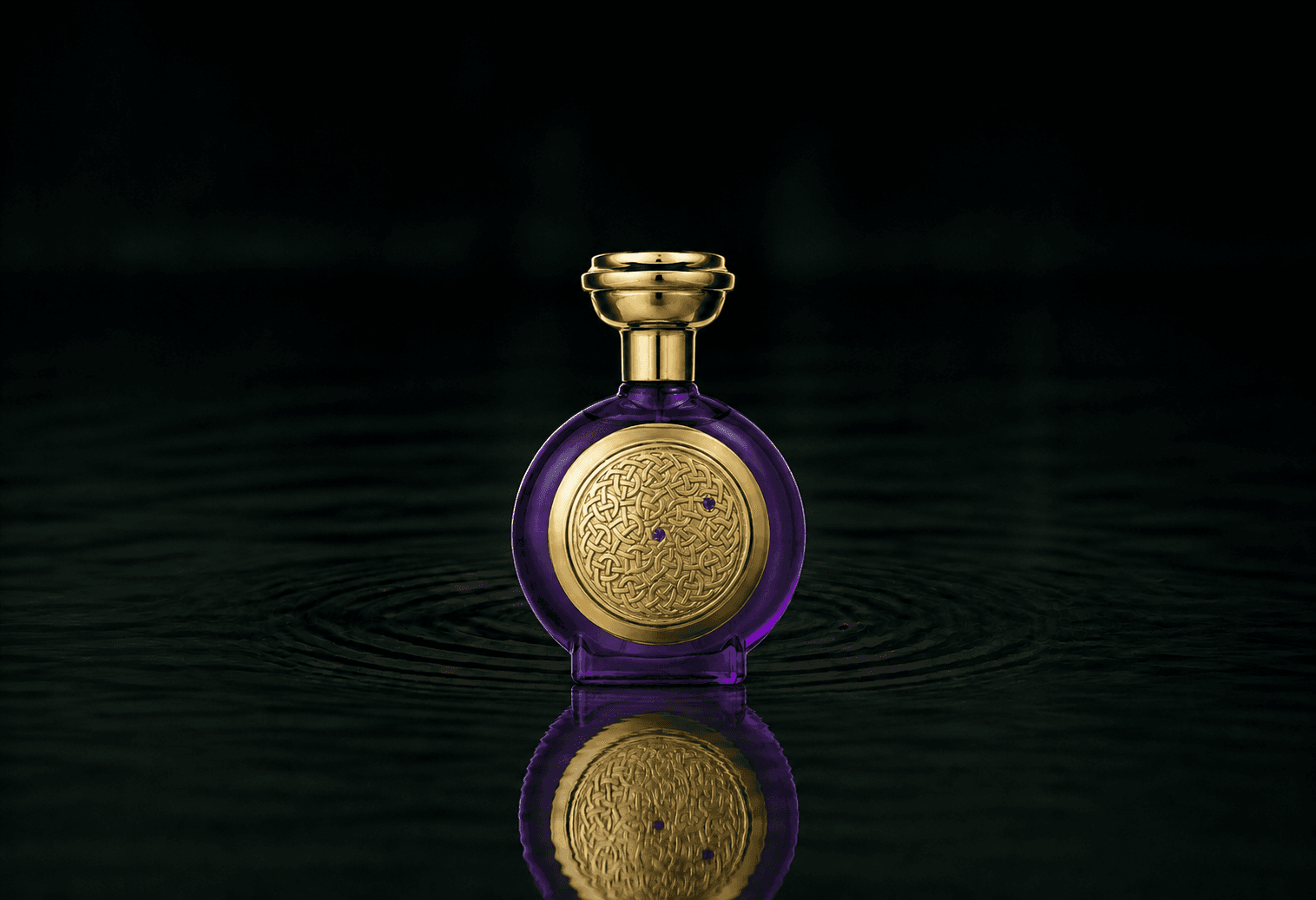 Boadicea The Victorious Violet Sapphire Supercharged fragrance bottle floating above dark water