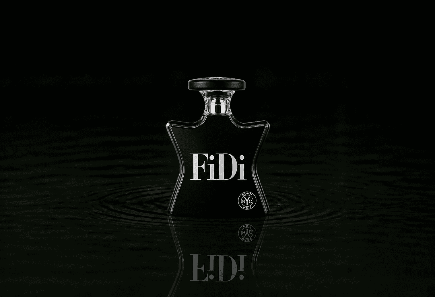 Bond No.9 Fidi fragrance bottle floating above dark water