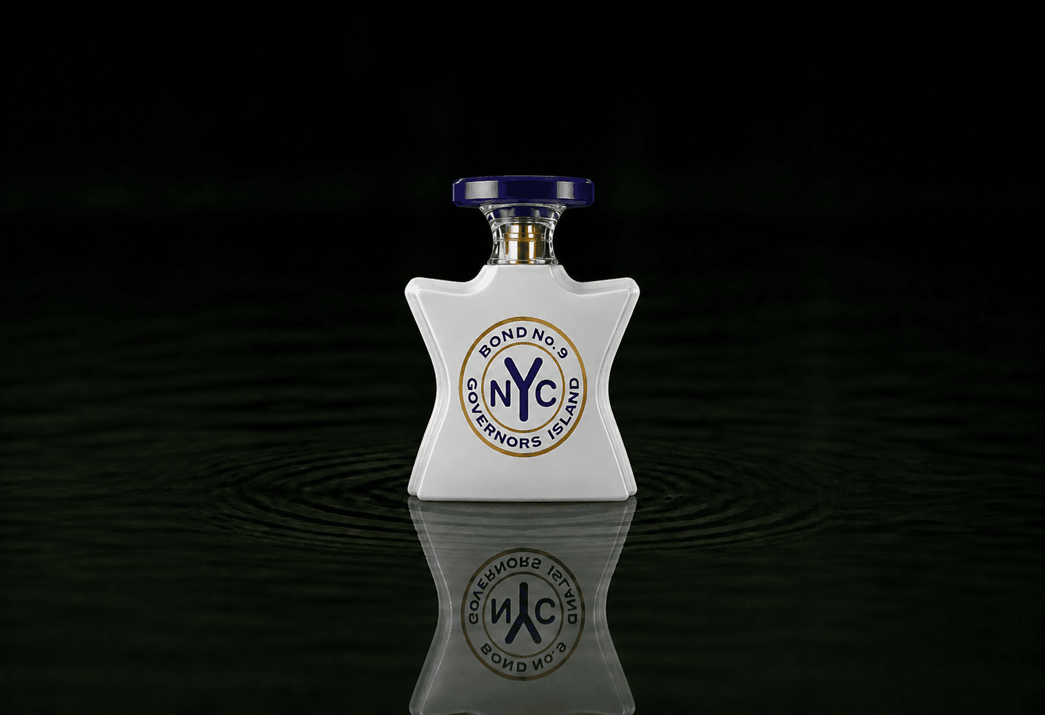 Bond No.9 Governors Island fragrance bottle floating above dark water