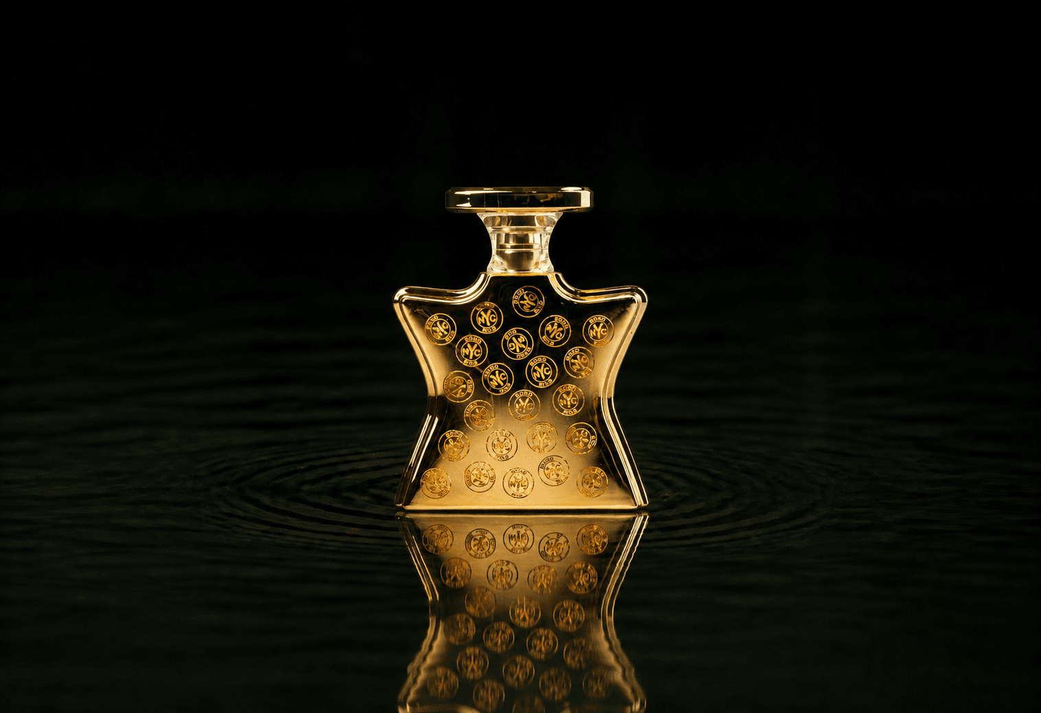 Bond No.9 Signature Scent fragrance bottle floating above dark water