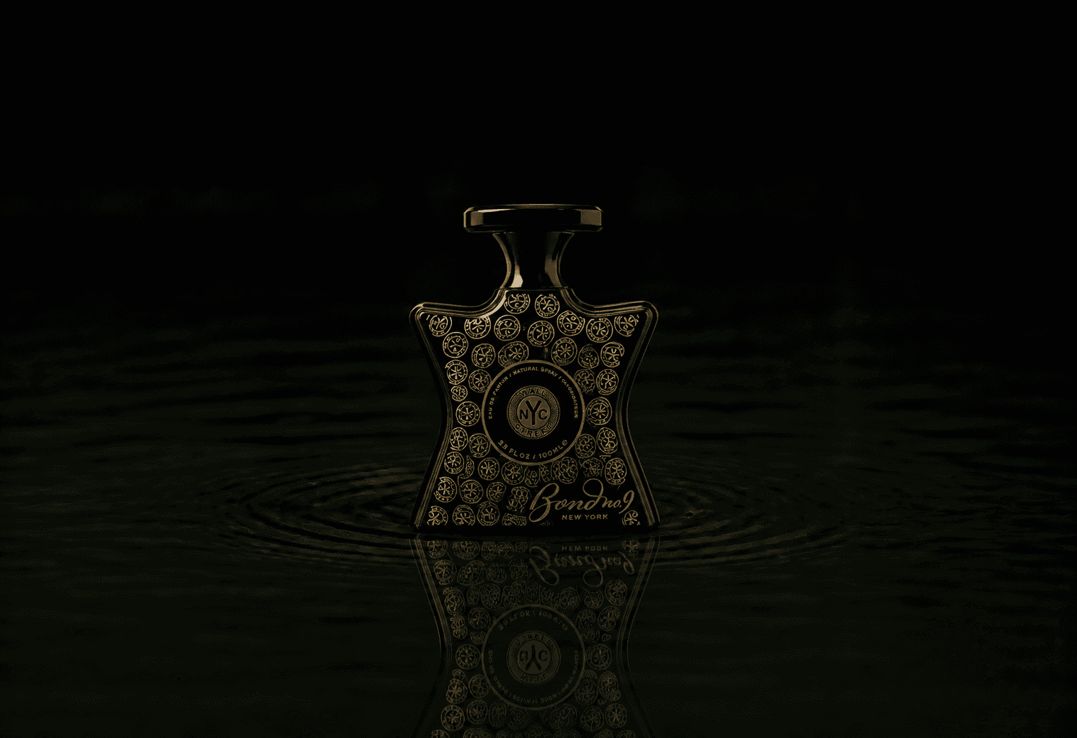 Bond No.9 Wall Street fragrance bottle floating above dark water