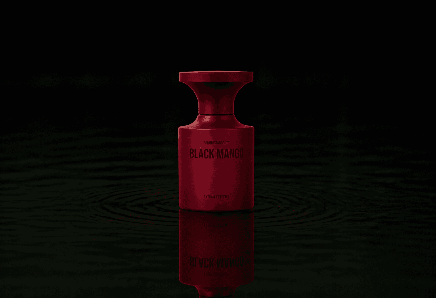 BORNTOSTANDOUT Black Mango - Extrait Extreme fragrance bottle floating above dark water