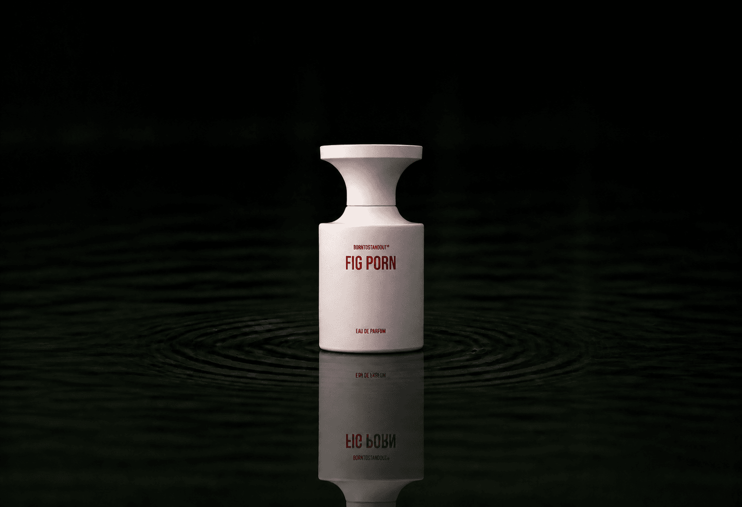 BORNTOSTANDOUT Fig Porn fragrance bottle floating above dark water
