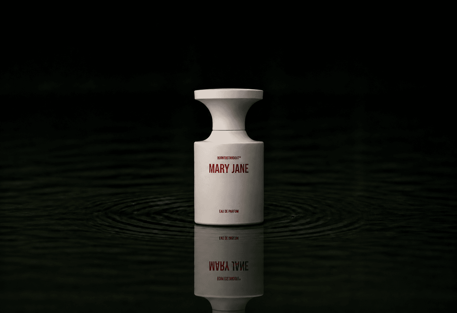BORNTOSTANDOUT Mary Jane fragrance bottle floating above dark water
