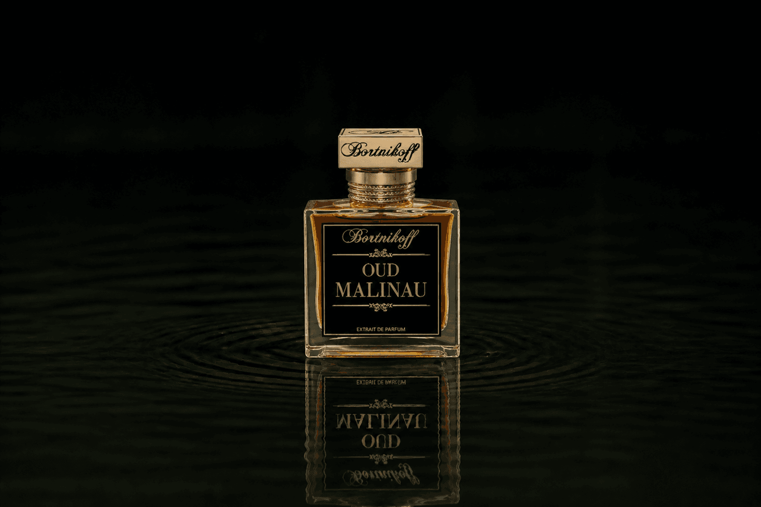 Bortnikoff Oud Malinau fragrance bottle floating above dark water
