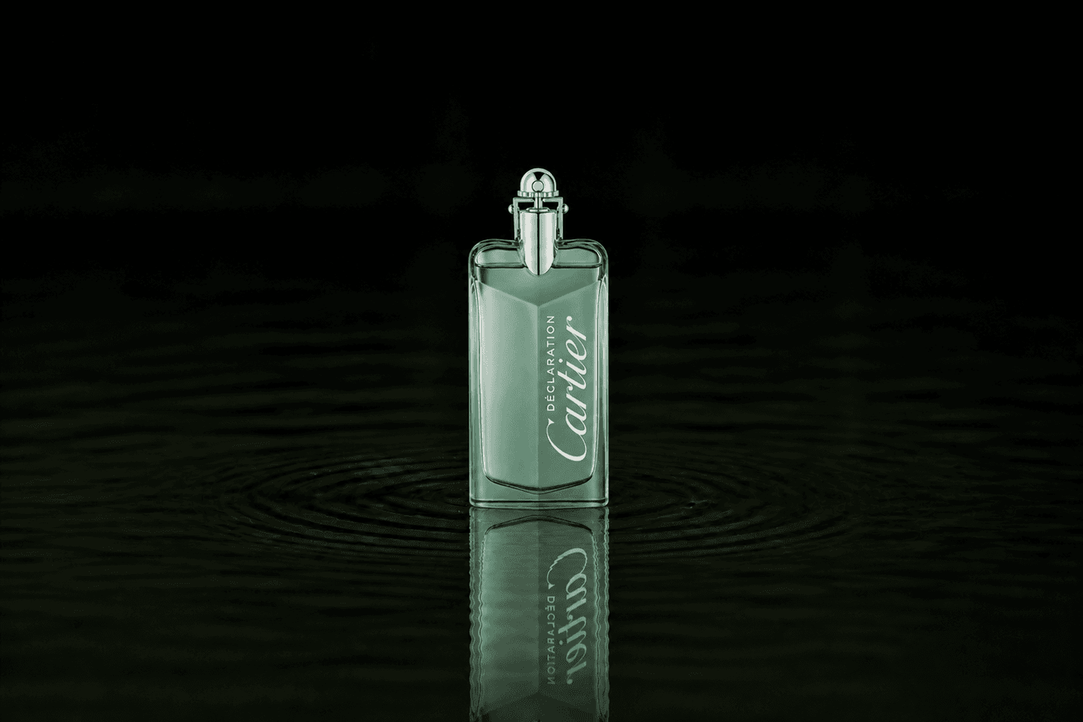 Cartier Declaration Haute Fraicheur fragrance bottle floating above dark water