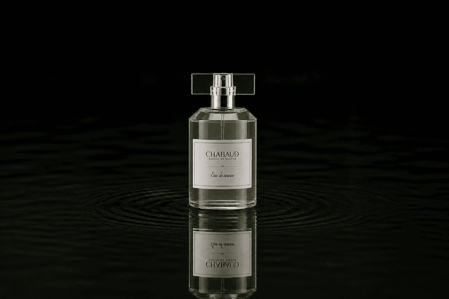 Chabaud Eau De Source fragrance bottle floating above dark water