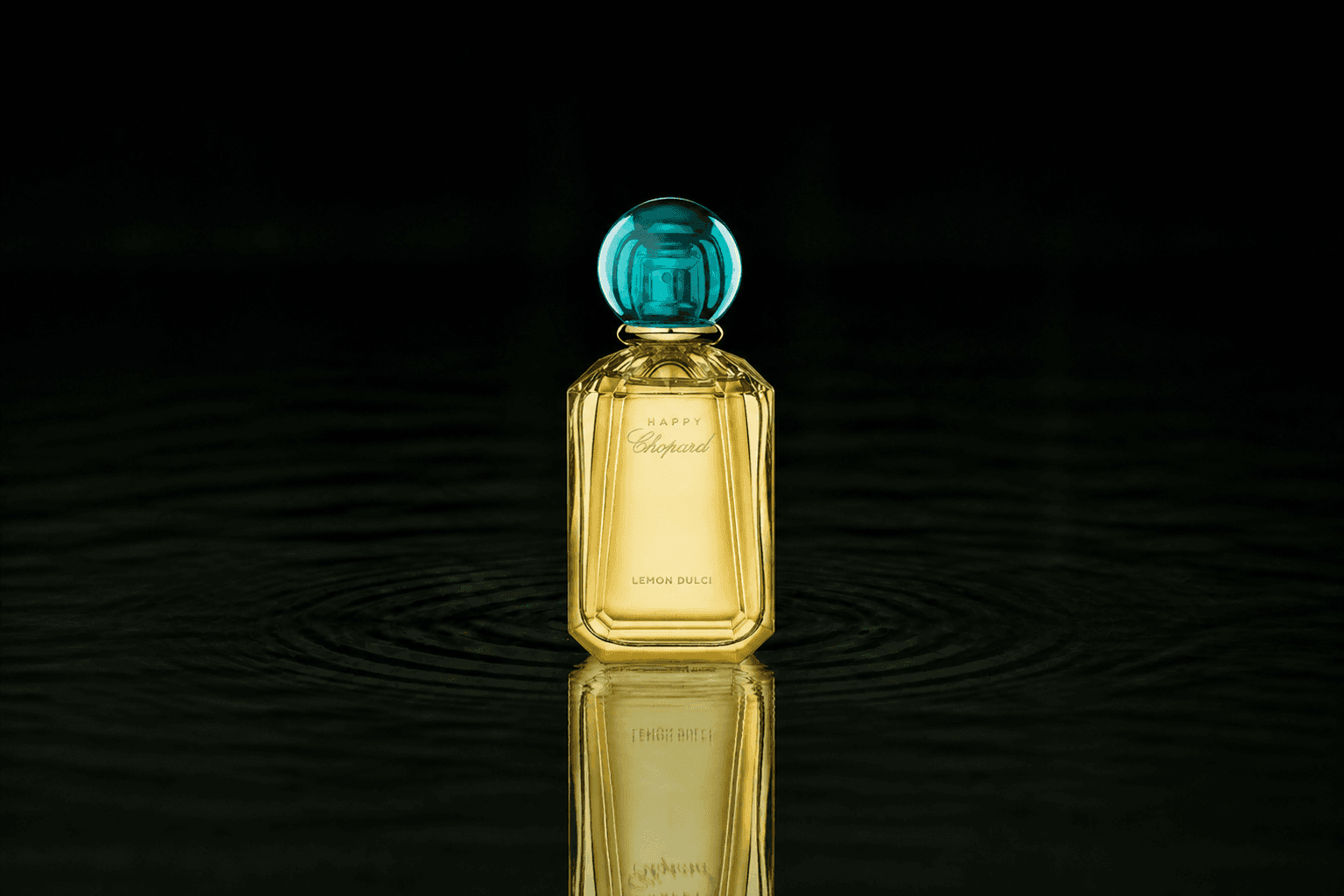 Chopard Happy Chopard - Lemon Dulci fragrance bottle floating above dark water