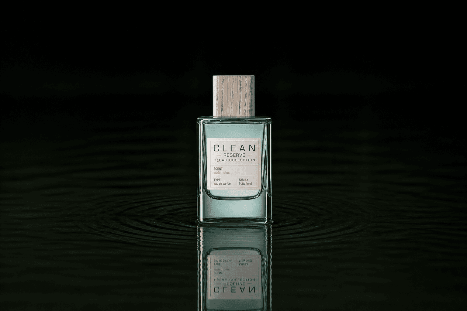 Clean Reserve H2EAU Water Lotus fragrance bottle floating above dark water