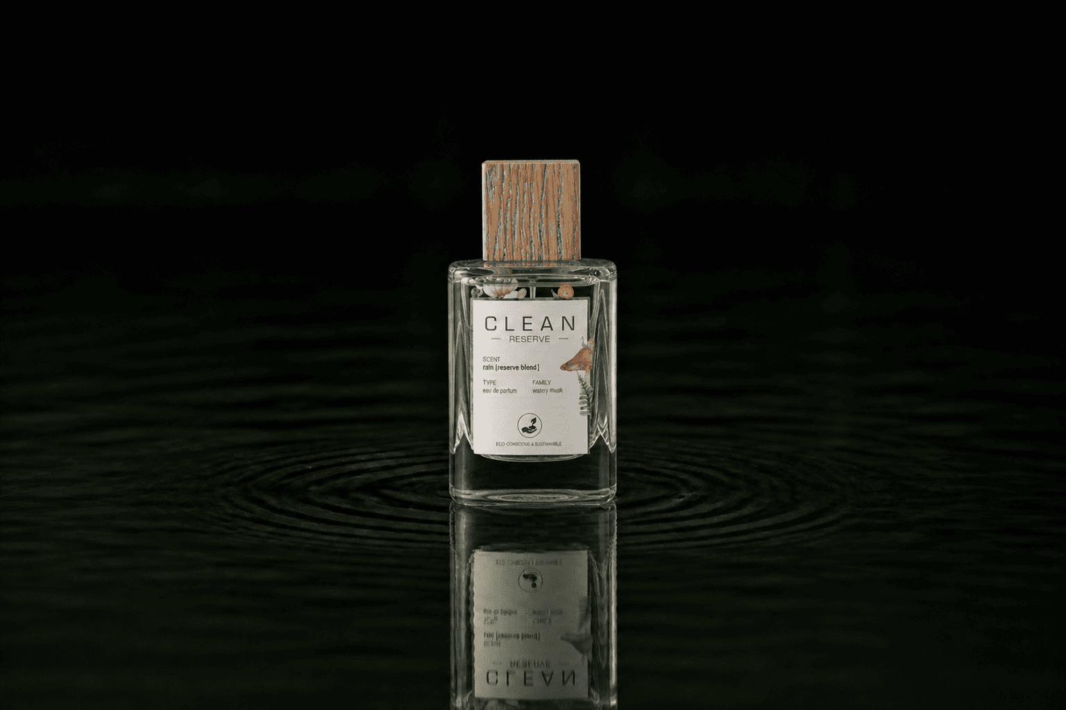 Clean Reserve Rain EDP Limited edition fragrance bottle floating above dark water