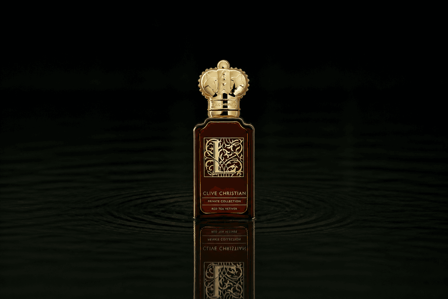 Clive Christian L Red Tea Vetiver fragrance bottle floating above dark water