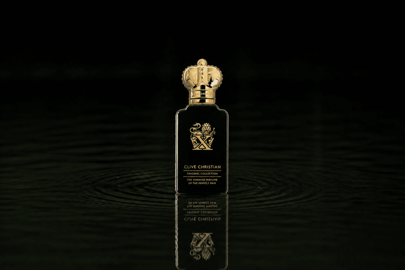 Clive Christian Original Collection X Feminine fragrance bottle floating above dark water
