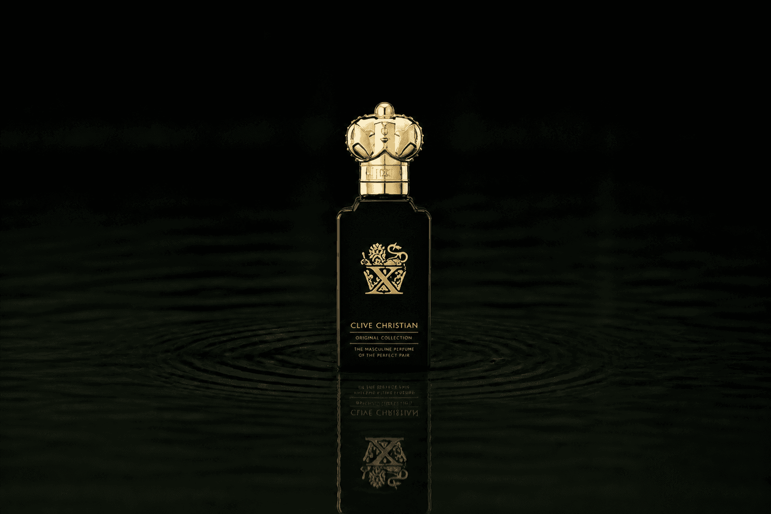 Clive Christian Original Collection X Masculine fragrance bottle floating above dark water