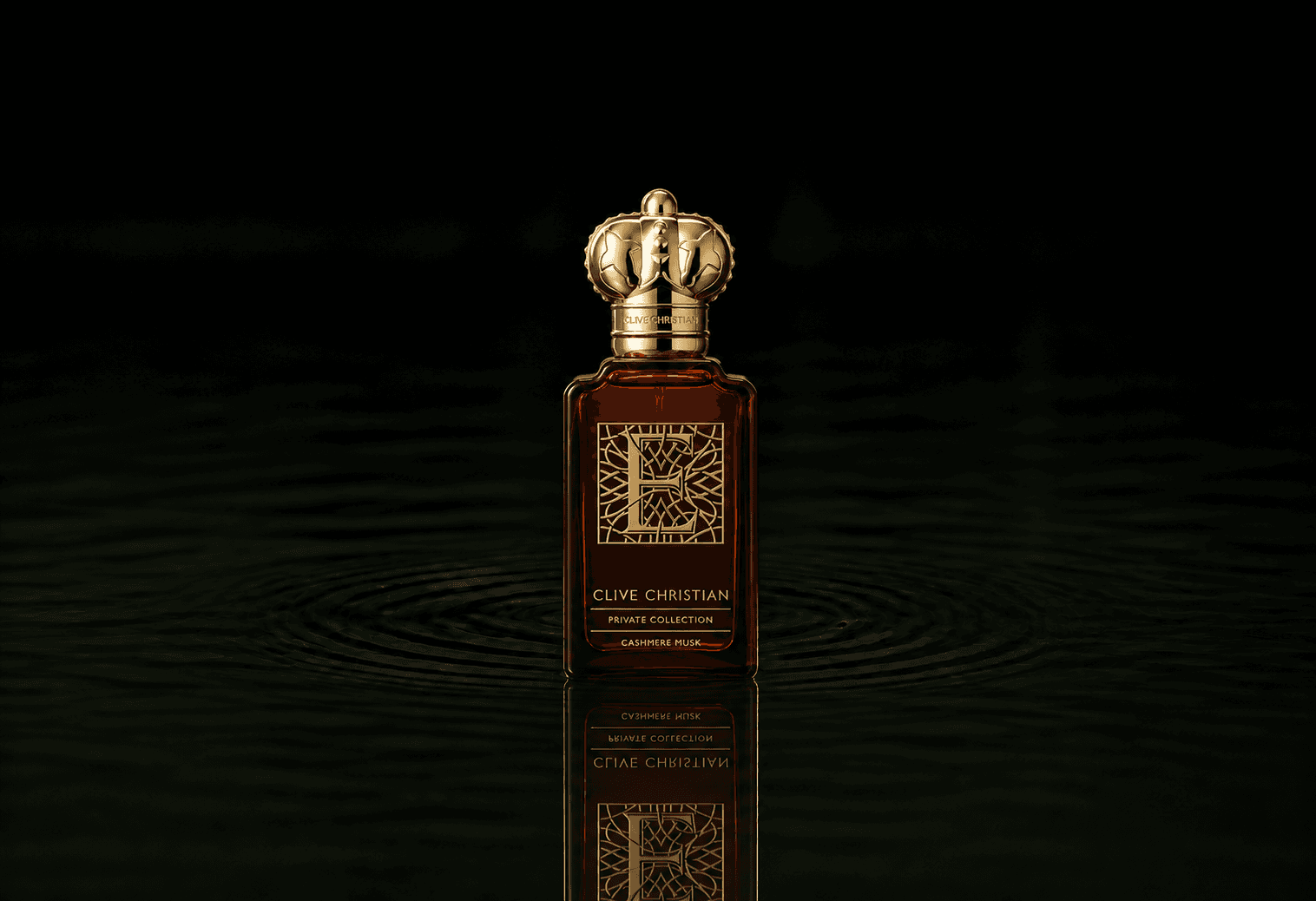 Clive Christian Private Collection E Cashmere Musk fragrance bottle floating above dark water