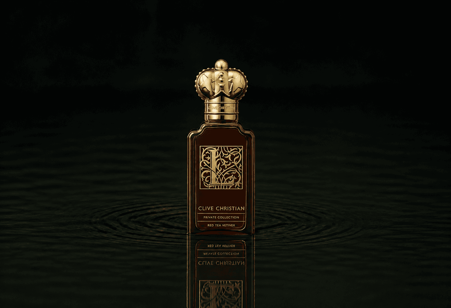Clive Christian Private Collection L Red Tea Vetiver fragrance bottle floating above dark water