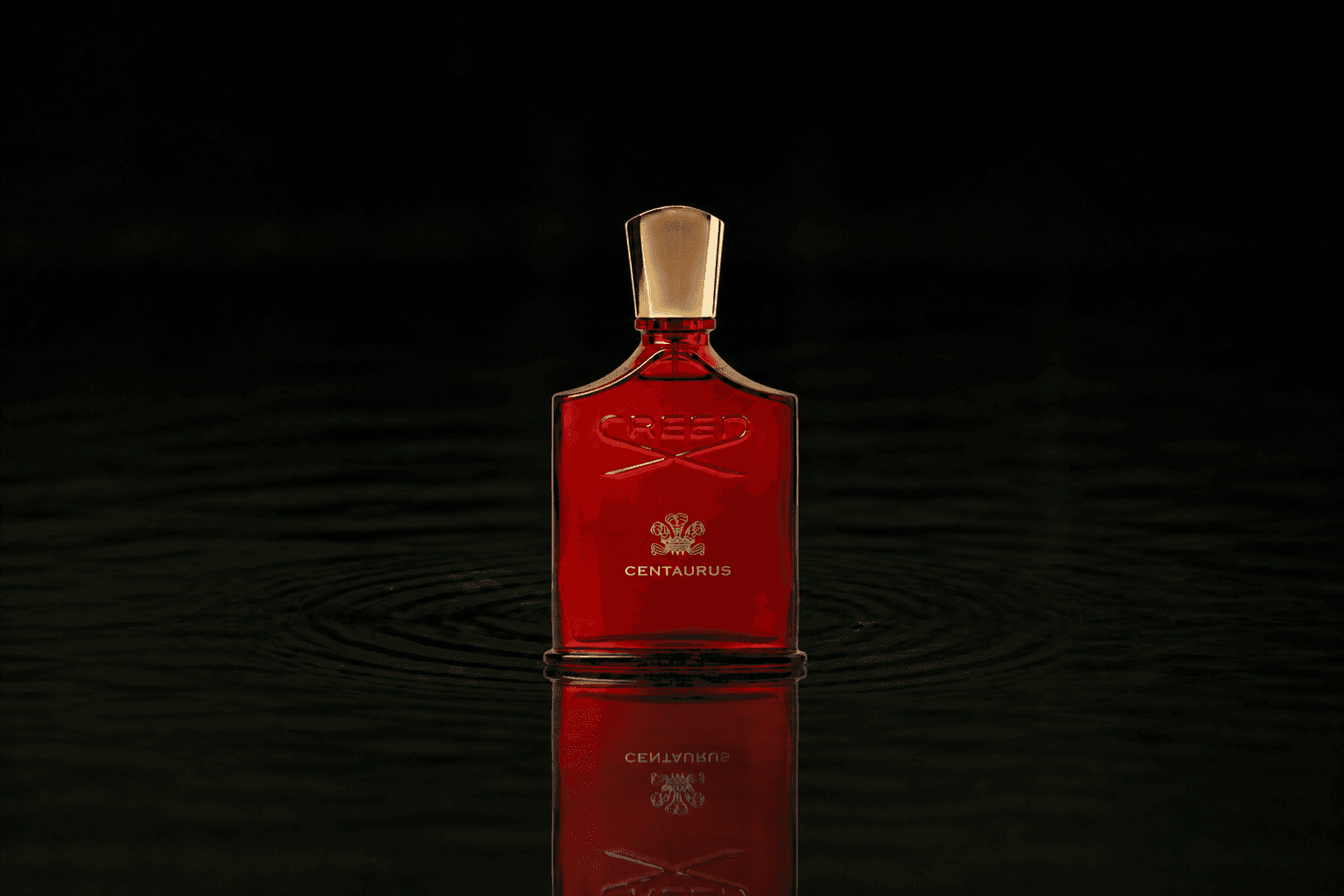 Creed Centaurus fragrance bottle floating above dark water