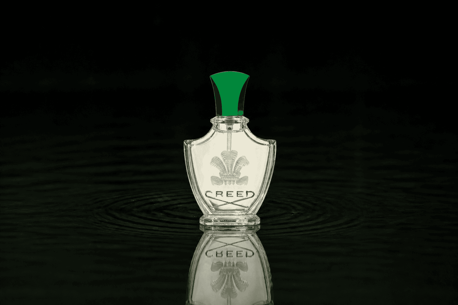 Creed Fleurissimo fragrance bottle floating above dark water