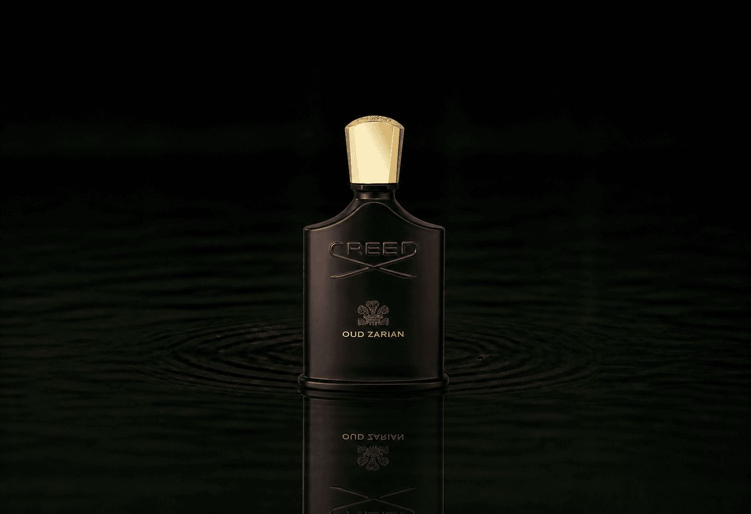 Creed Oud Zarian fragrance bottle floating above dark water