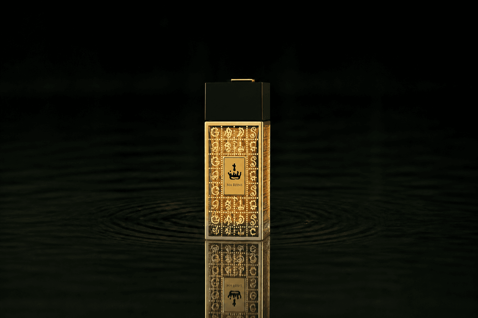 Dali Haute Daligramme Ma Reine fragrance bottle floating above dark water