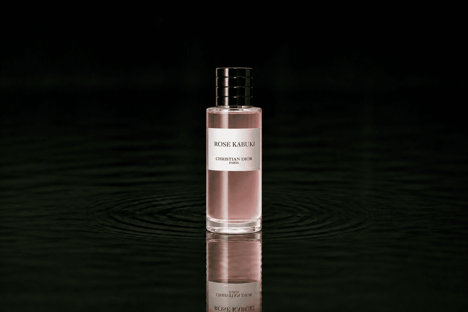 Dior Christian Dior - Rose Kabuki fragrance bottle floating above dark water
