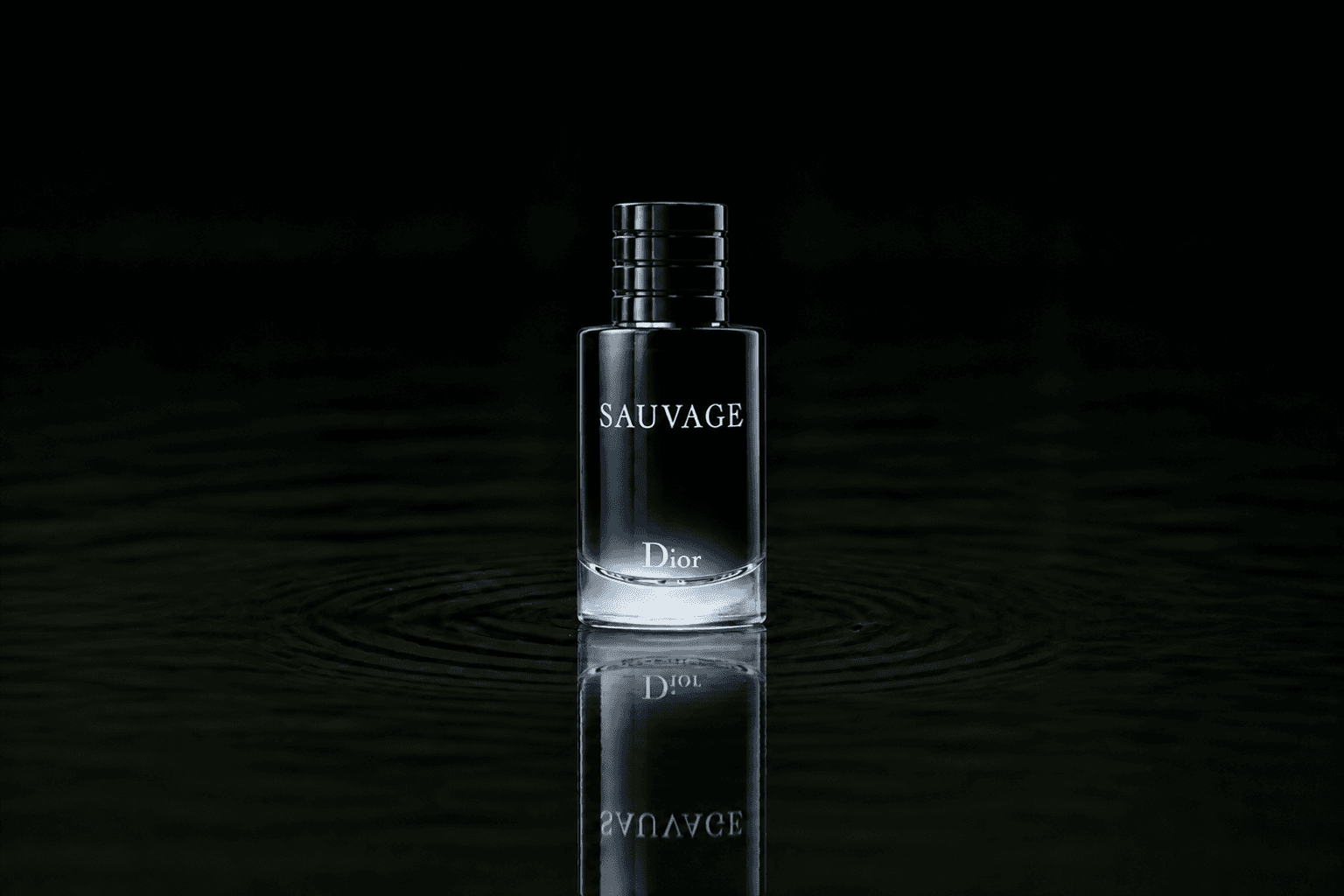 Dior Sauvage fragrance bottle floating above dark water