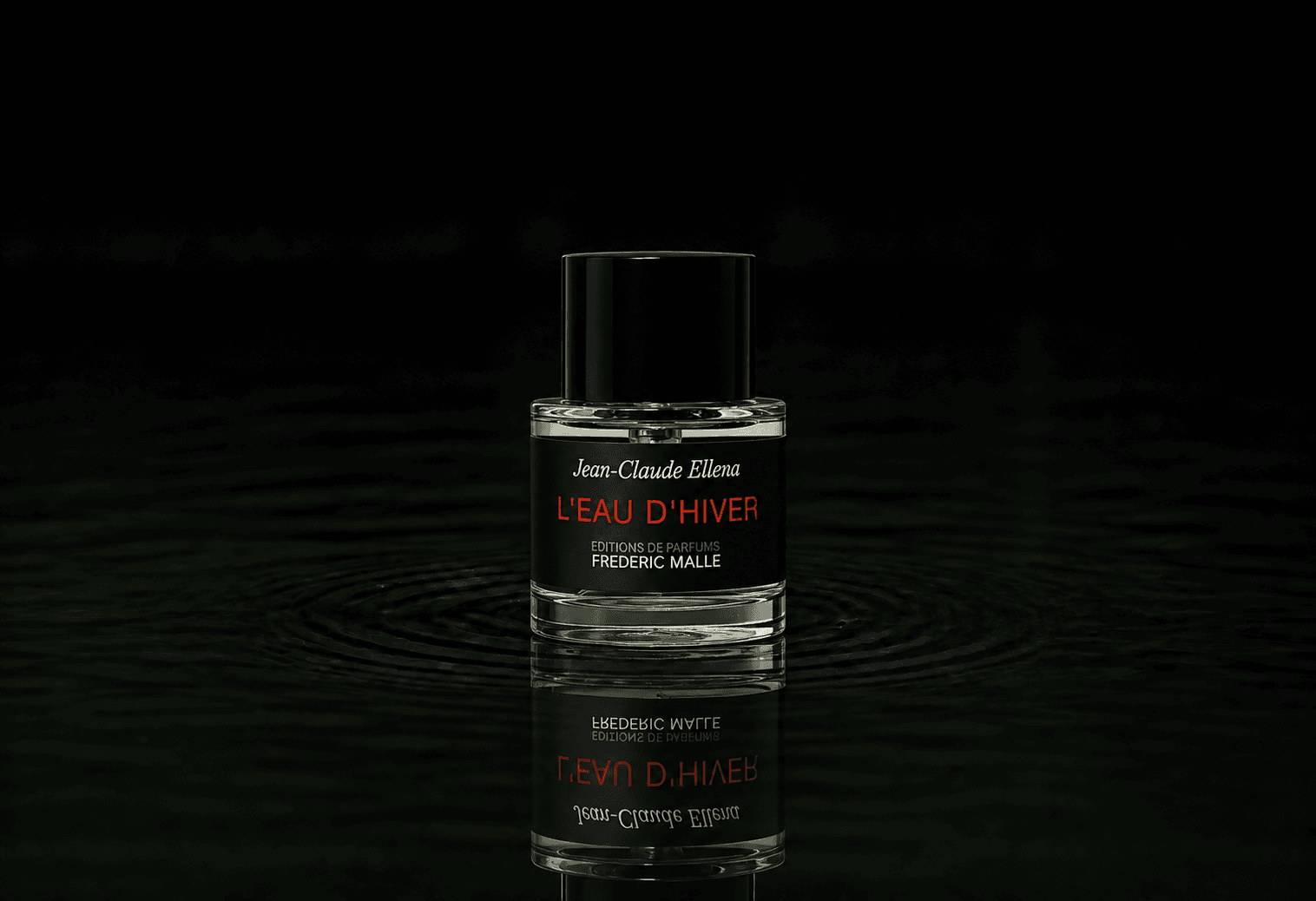 Editions de Parfums Frederic Malle L'Eau d'Hiver fragrance bottle floating above dark water