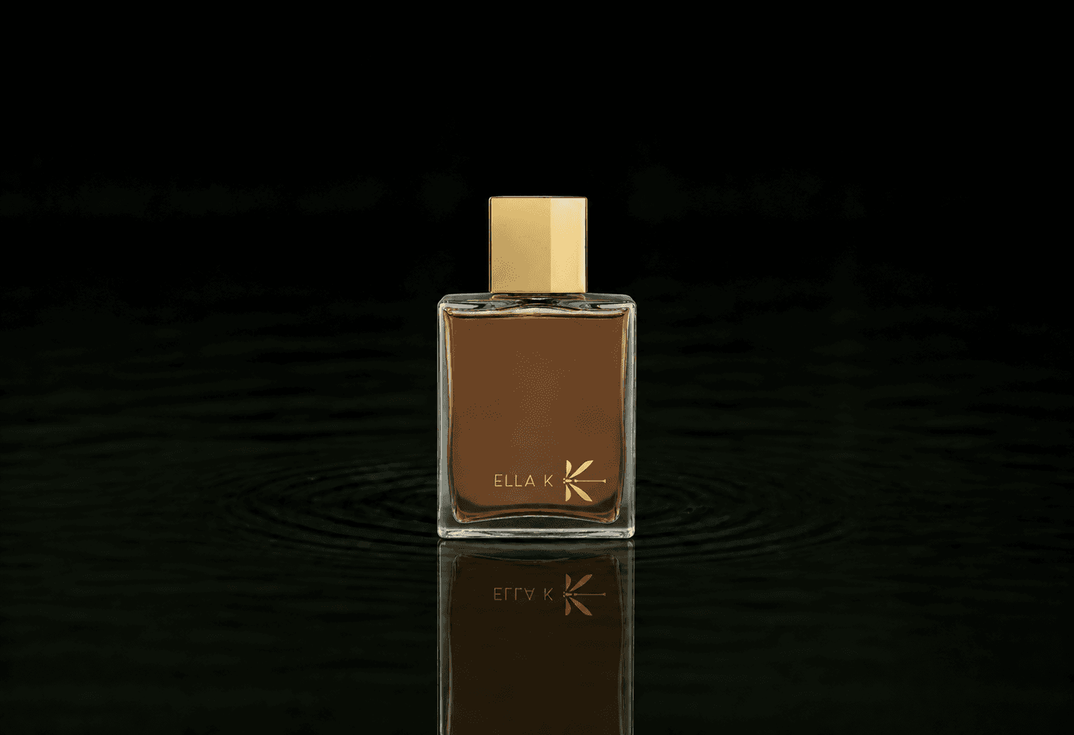 Ella K Cri Du Kalahari fragrance bottle floating above dark water