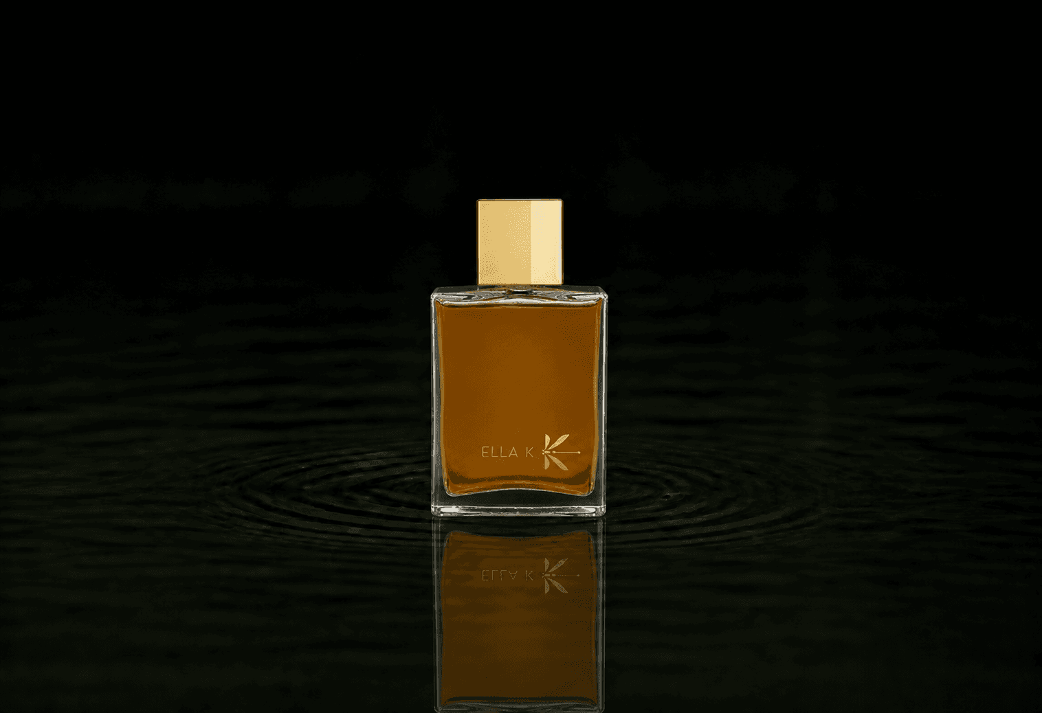 Ella K Khamsin fragrance bottle floating above dark water