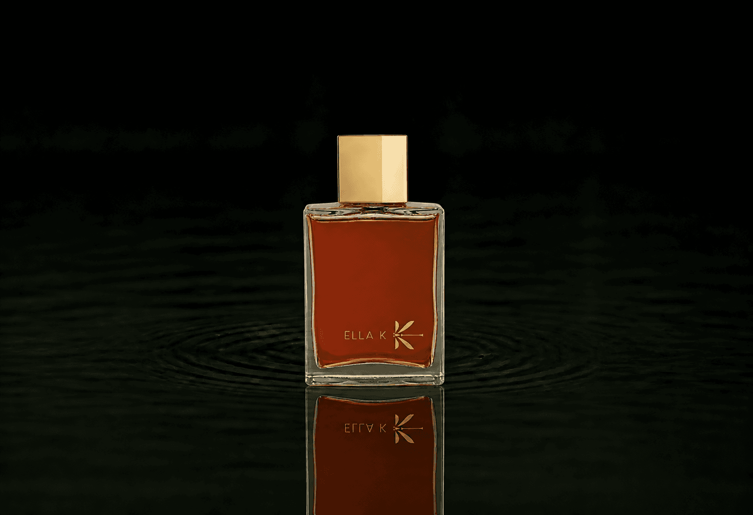 Ella K Lettre De Pushkar fragrance bottle floating above dark water