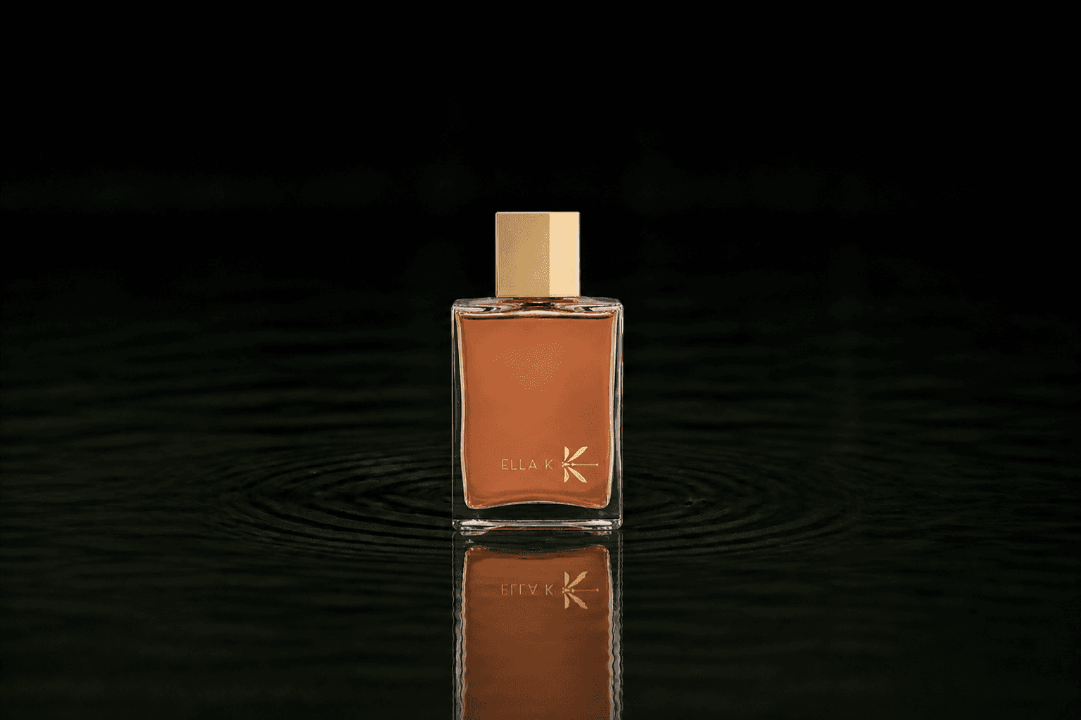 Ella K Mélodie De L’altaï fragrance bottle floating above dark water