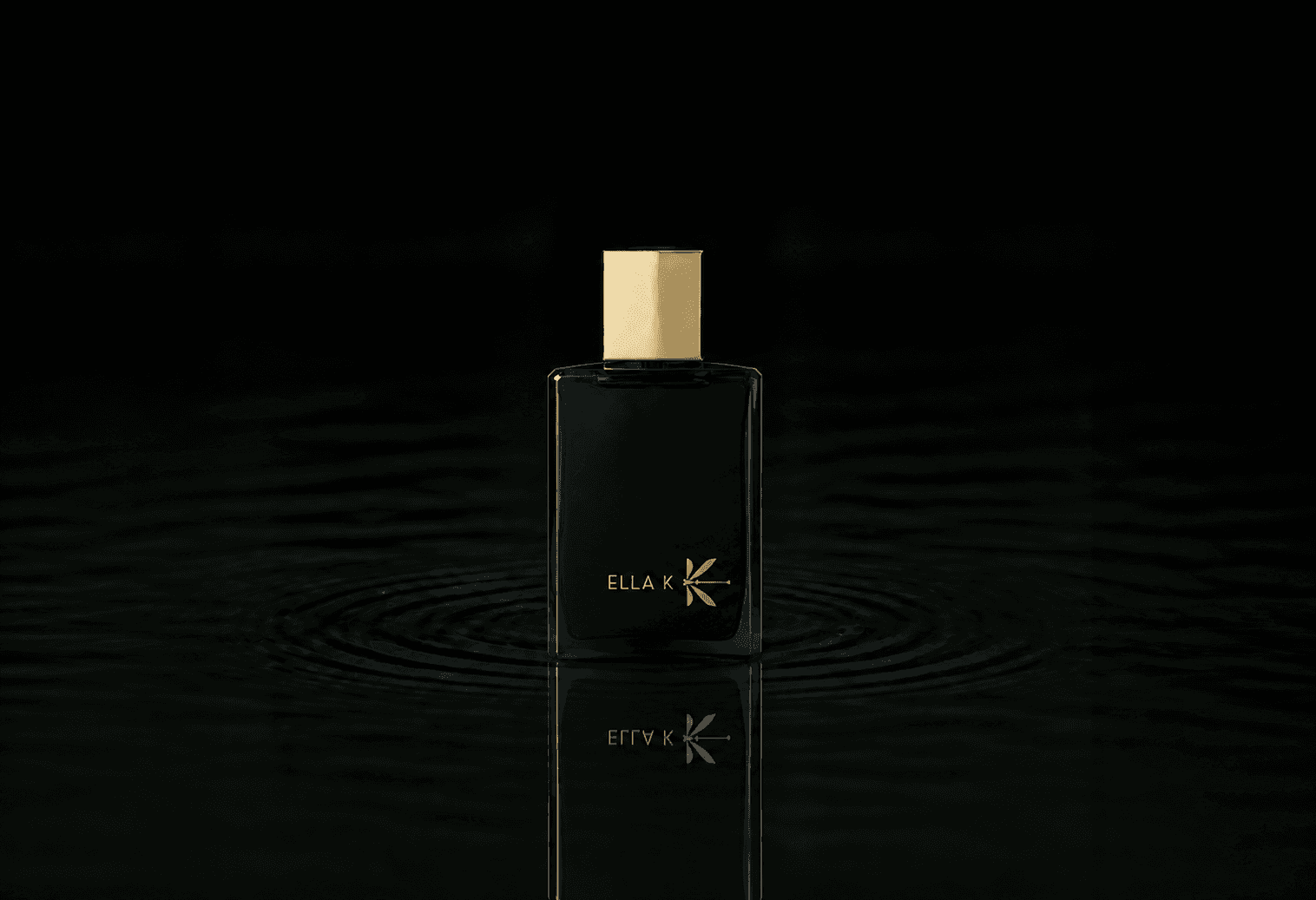 Ella K Myrrh K fragrance bottle floating above dark water