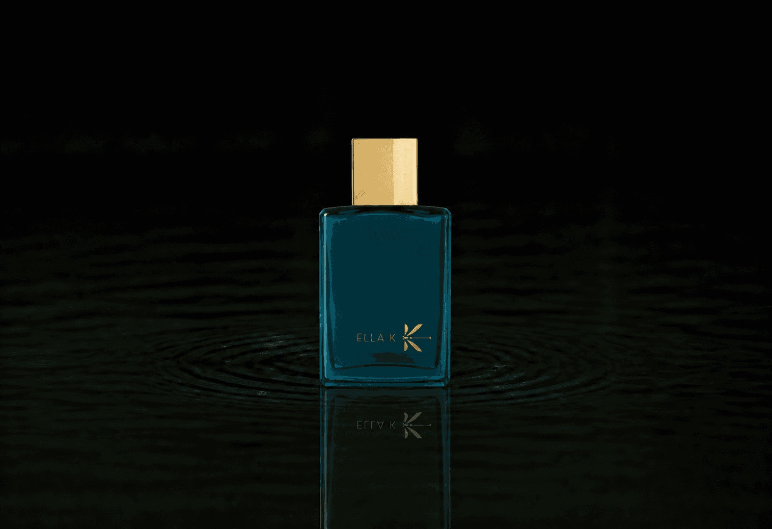 Ella K Orchid K fragrance bottle floating above dark water