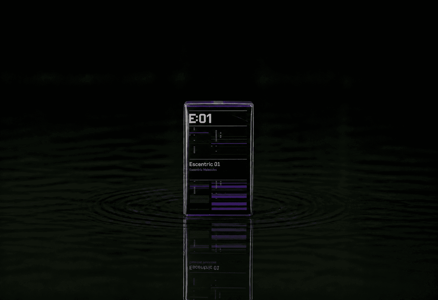 Escentric Molecules Escentric 01 fragrance bottle floating above dark water