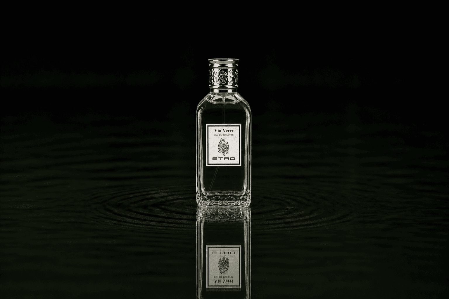 Etro Via Verri fragrance bottle floating above dark water