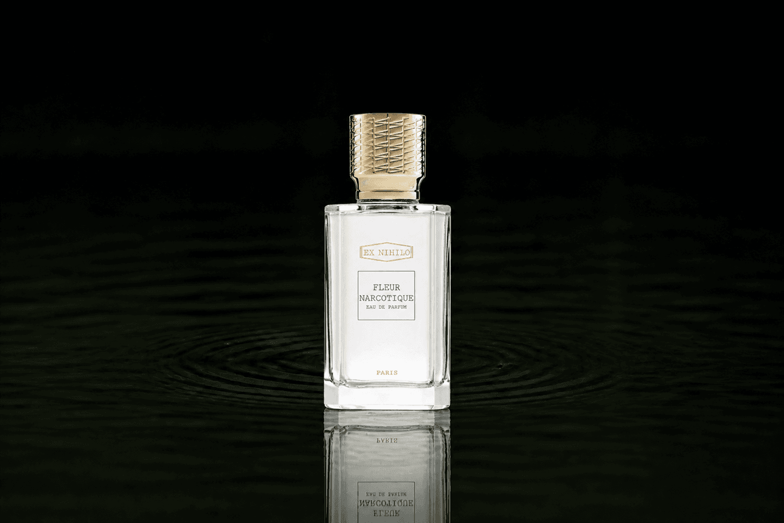 Ex Nihilo Paris Collection Initiale - Fleur Narcotique fragrance bottle floating above dark water