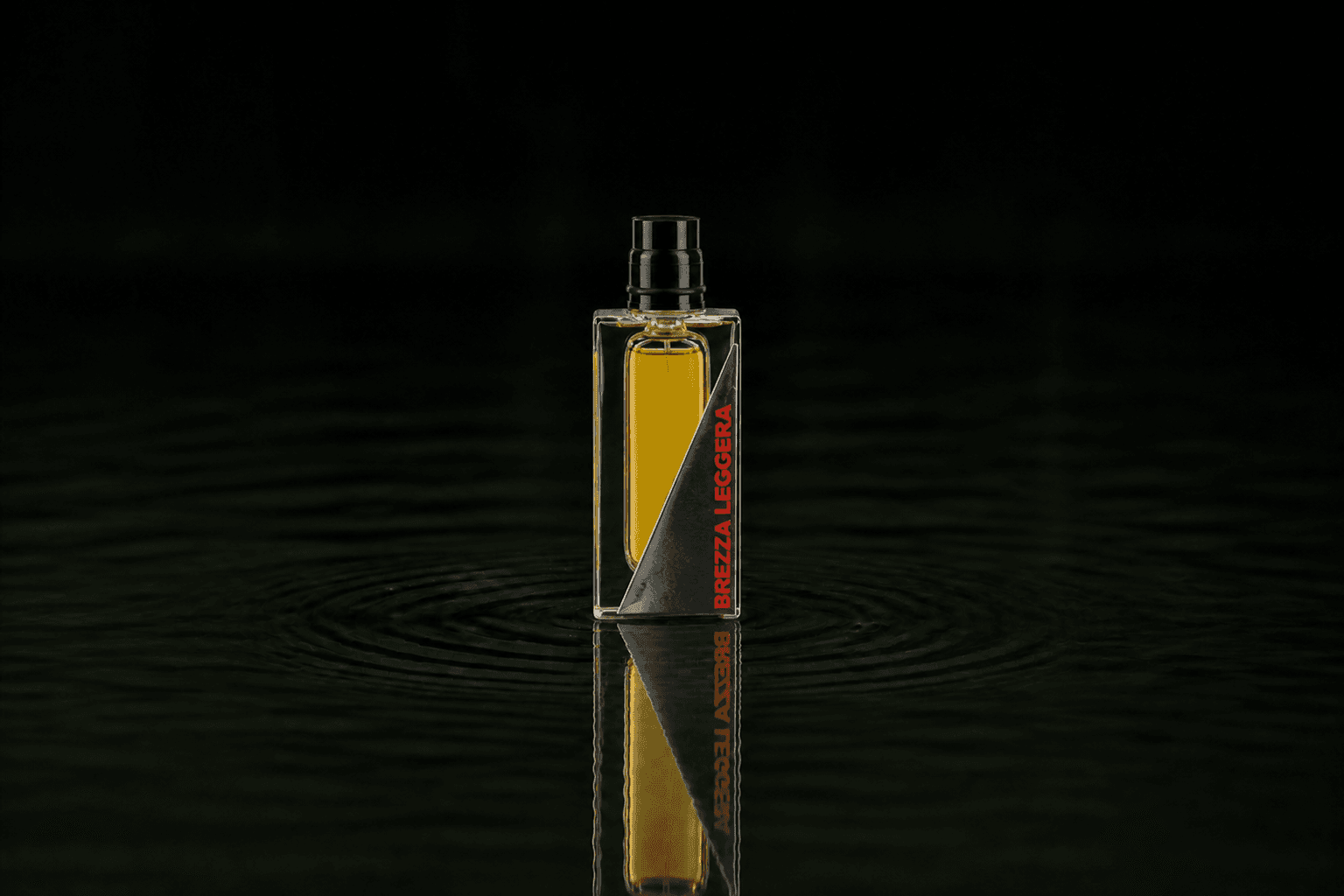 Filippo Sorcinelli Brezza Leggera Atmosphere De Emotion fragrance bottle floating above dark water