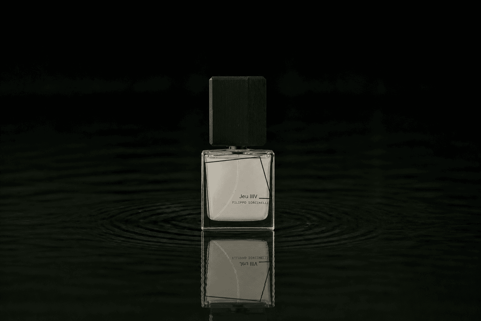 Filippo Sorcinelli Jeu IIIV fragrance bottle floating above dark water