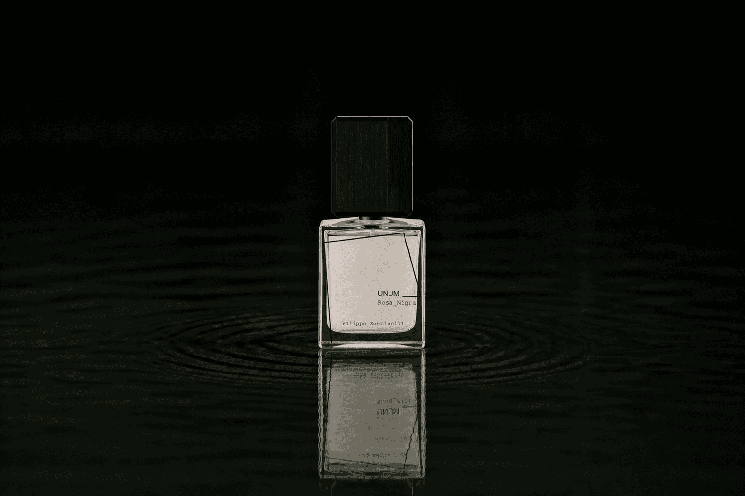 Filippo Sorcinelli Lux Visionaria fragrance bottle floating above dark water