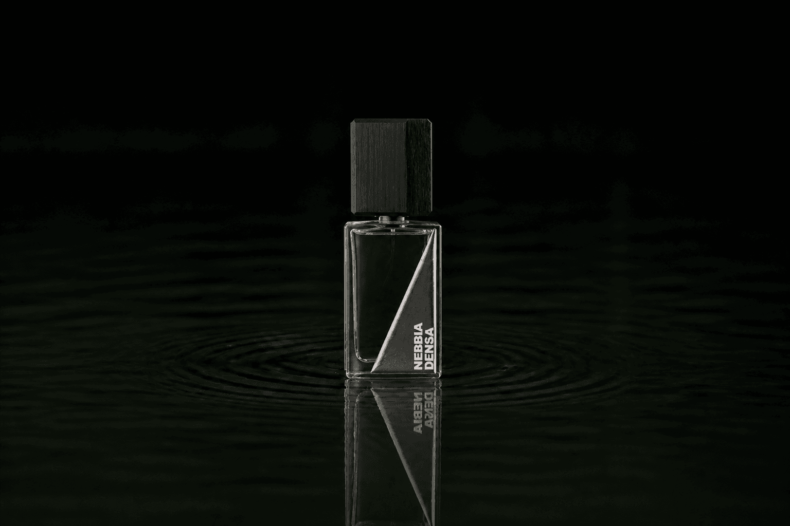 Filippo Sorcinelli Nebbia Densa fragrance bottle floating above dark water