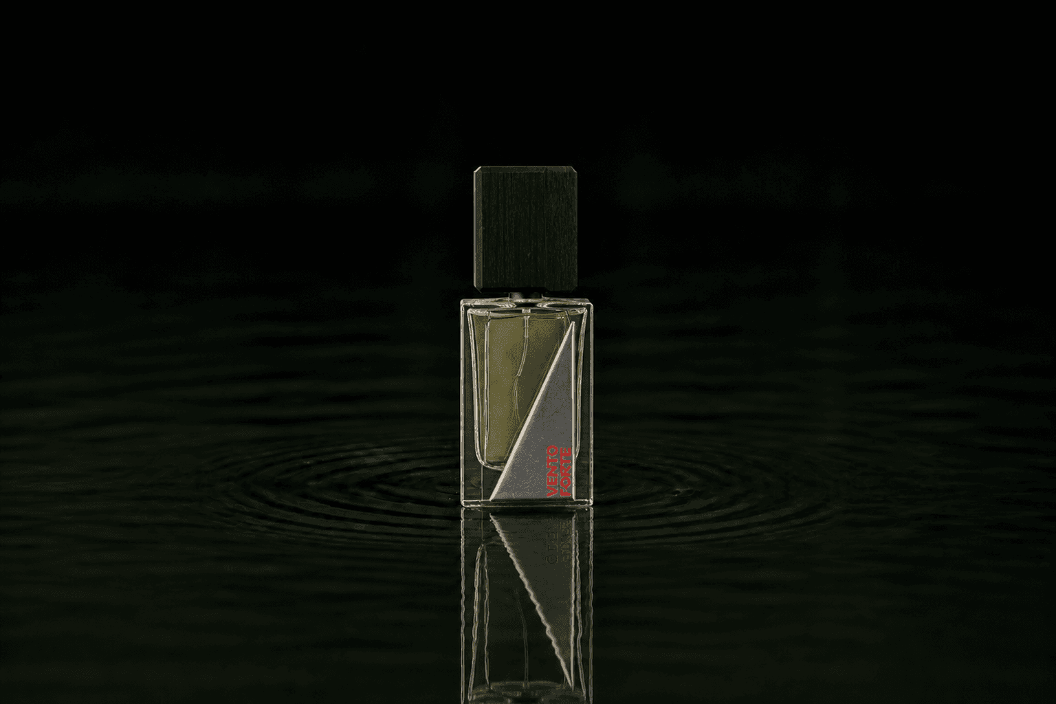 Filippo Sorcinelli Vento Forte Atmosphere De Emotion fragrance bottle floating above dark water