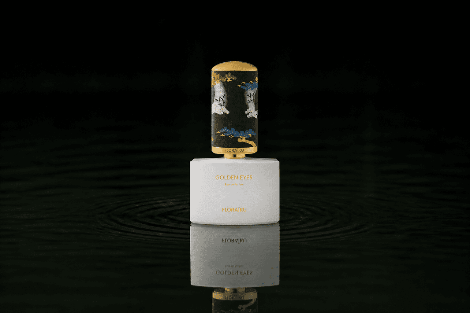 Floraiku Golden Eyes fragrance bottle floating above dark water