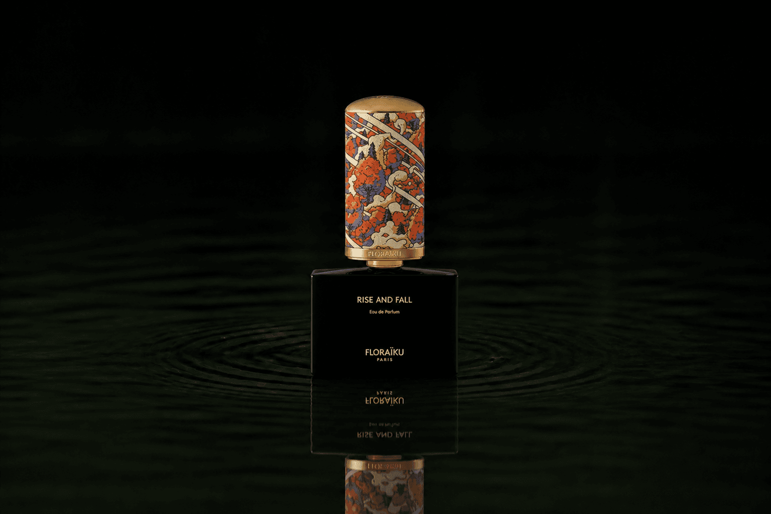 Floraiku Rise And Fall fragrance bottle floating above dark water