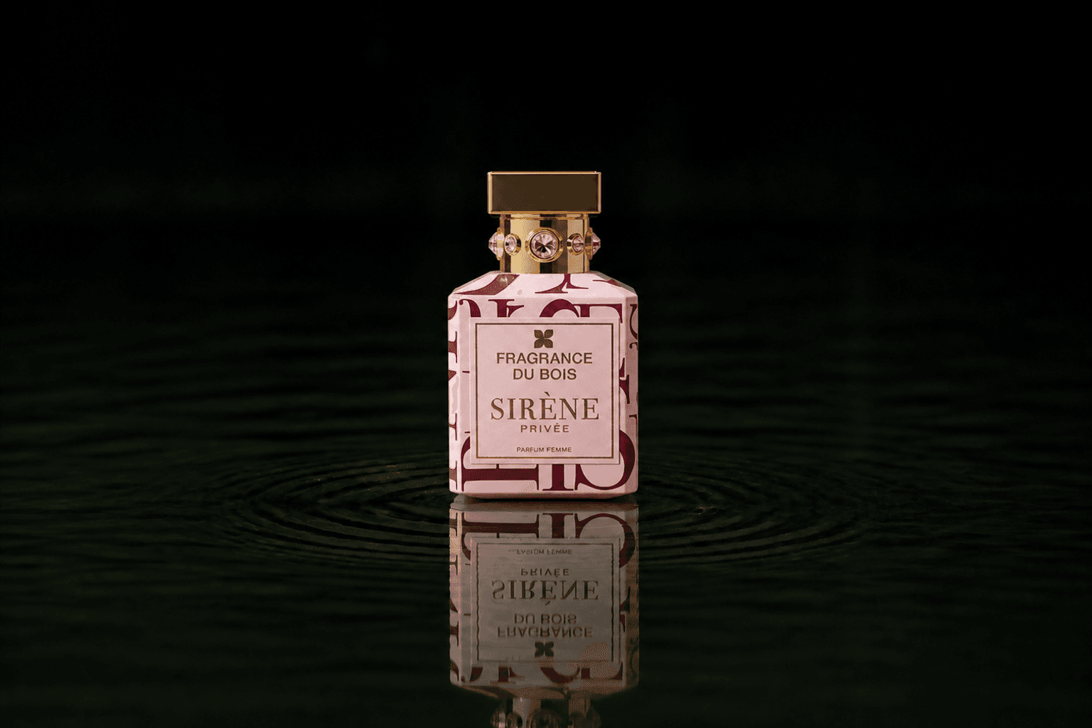 Fragrance Du Bois Sirene Privee fragrance bottle floating above dark water