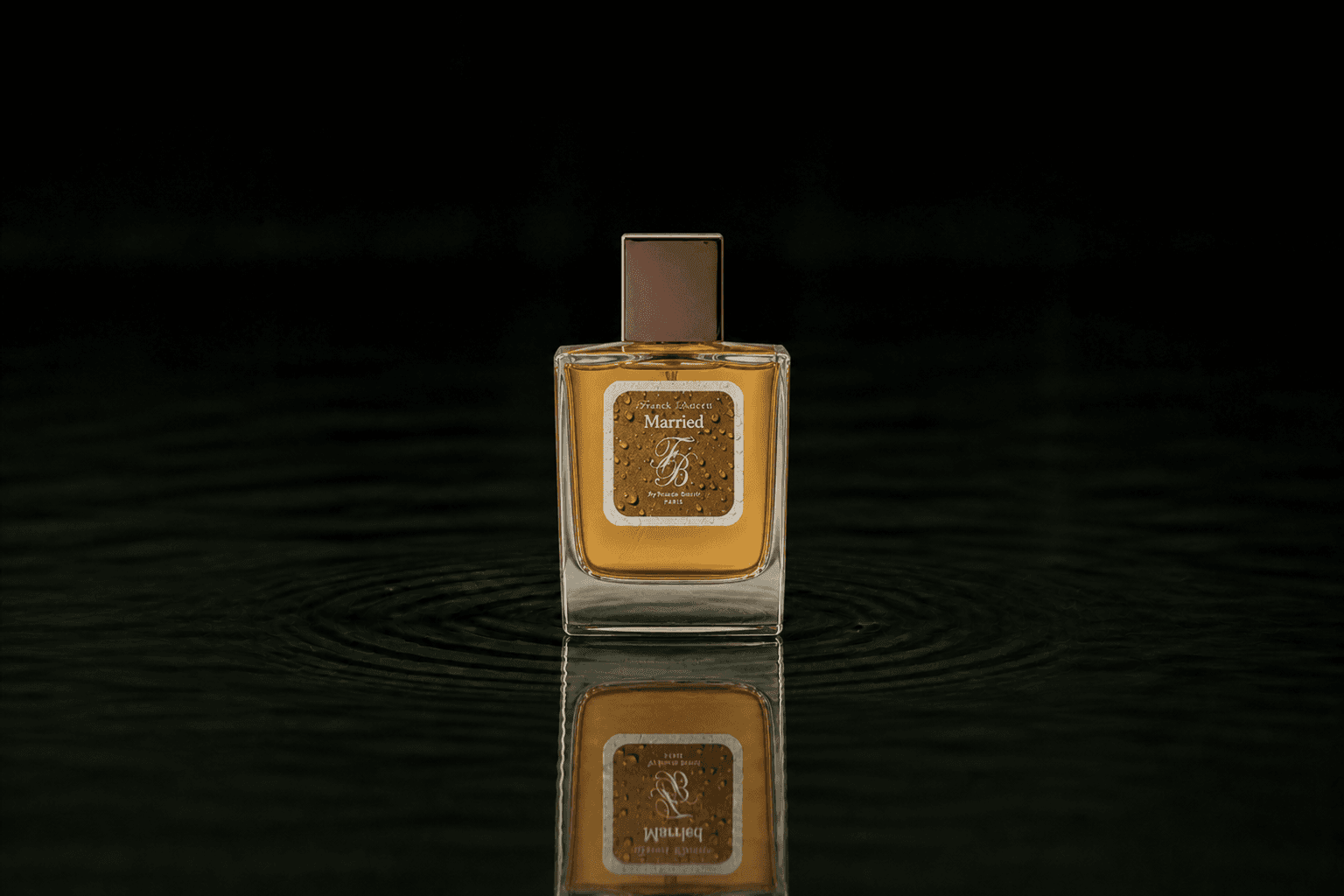 Franck Boclet Rock&Riot Married fragrance bottle floating above dark water