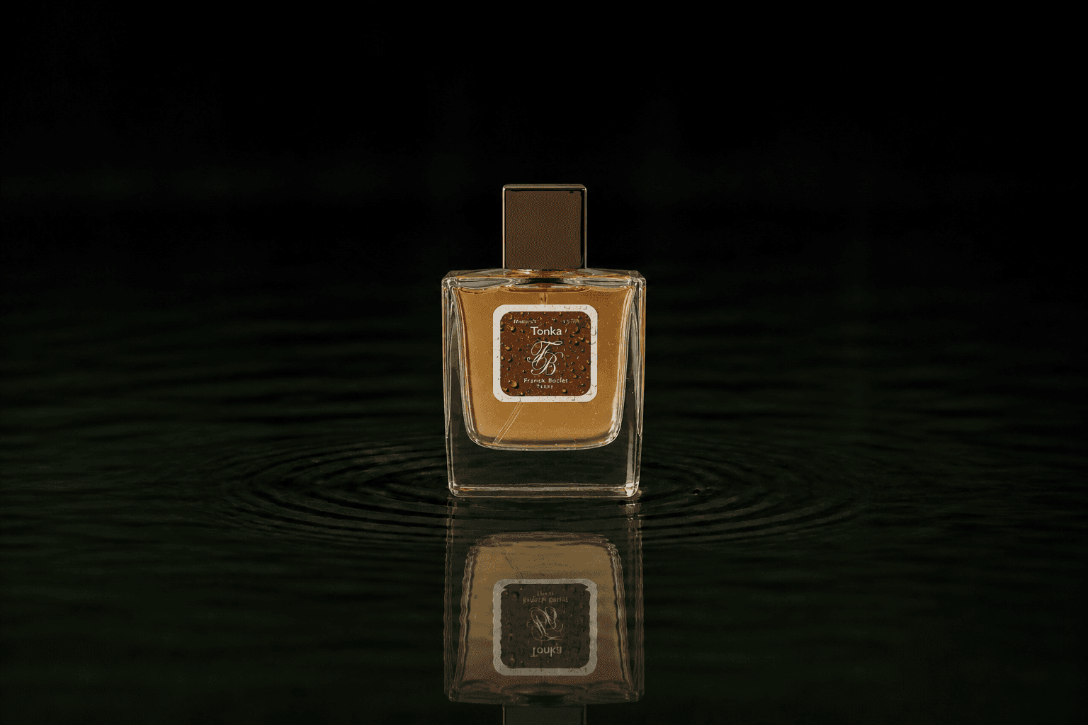 Franck Boclet Tonka fragrance bottle floating above dark water