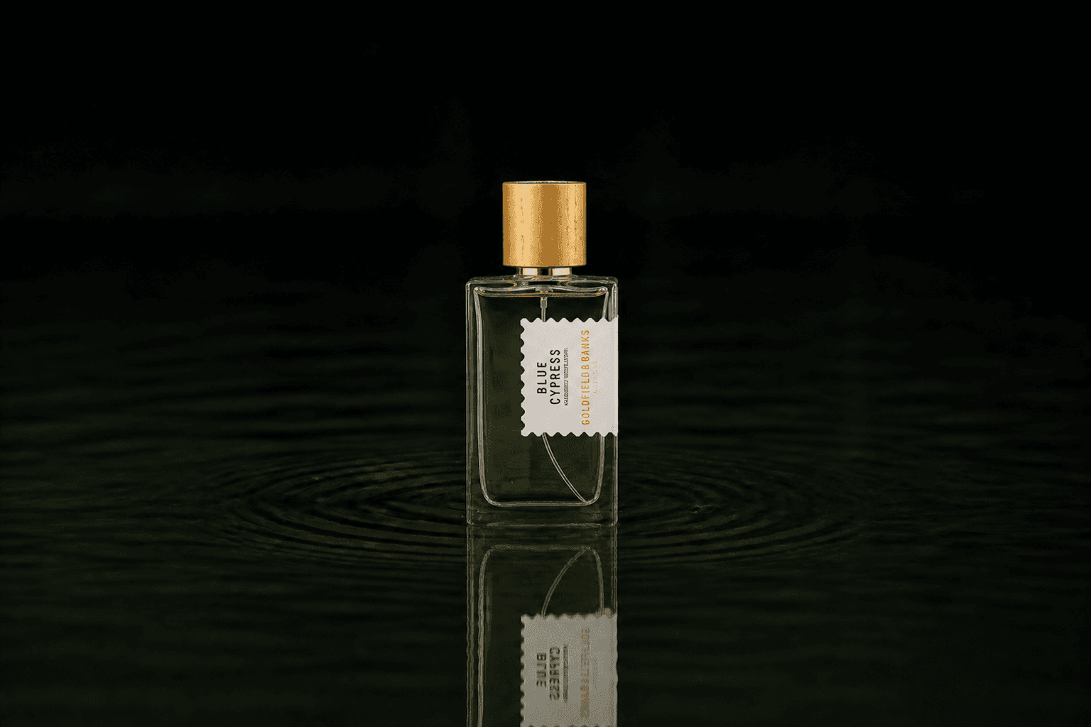 Goldfield & Banks Goldfield and Banks - Blue Cypress fragrance bottle floating above dark water