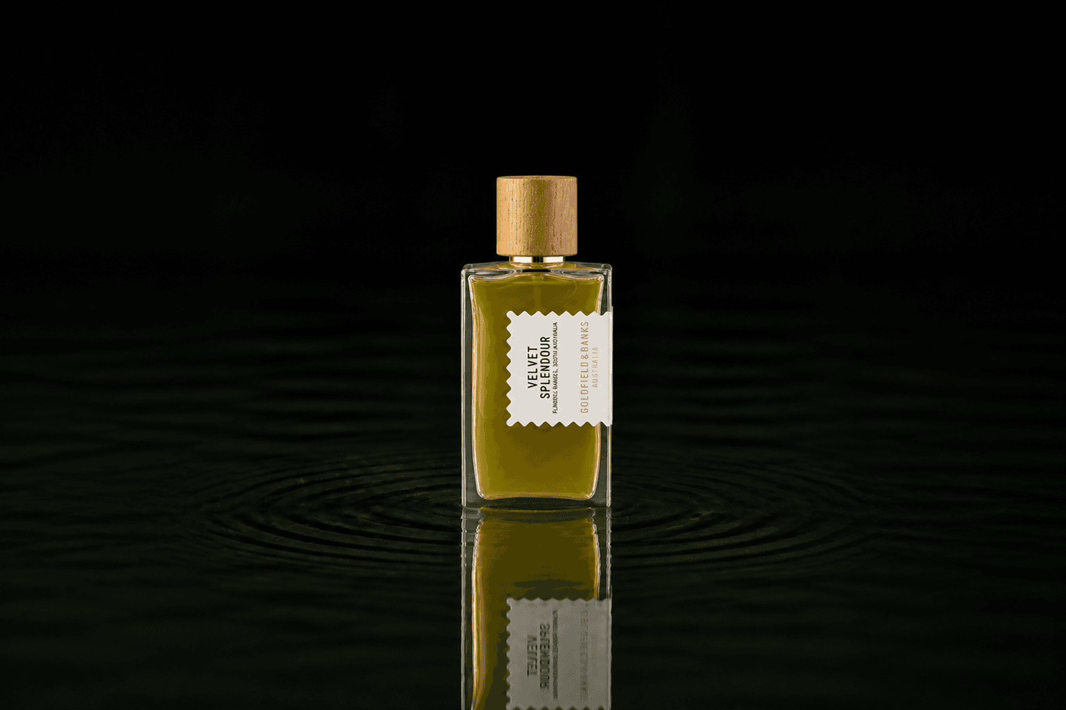 Goldfield & Banks Goldfield and Banks - Velvet Splendour fragrance bottle floating above dark water
