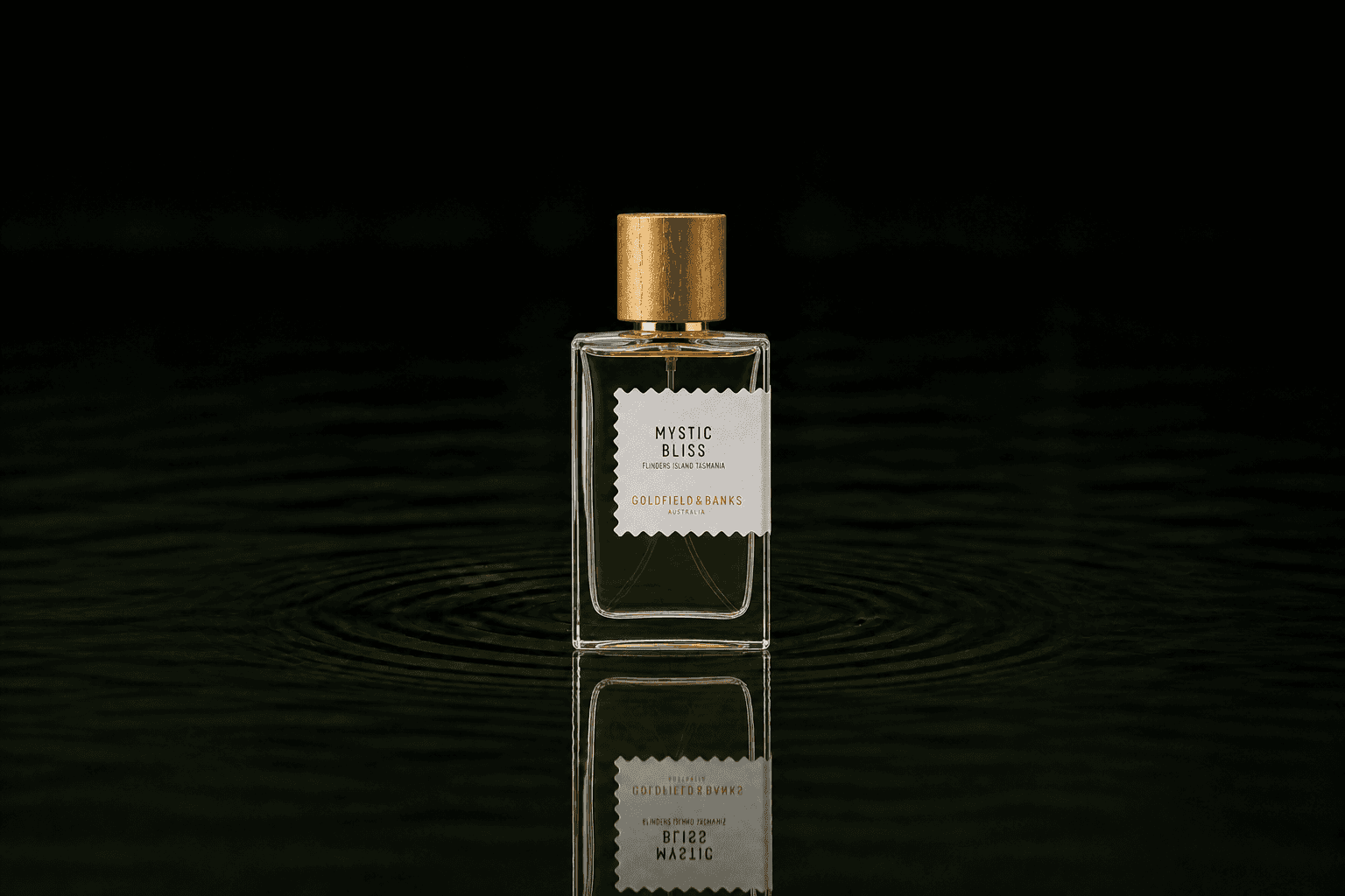 Goldfield & Banks Mystic Bliss fragrance bottle floating above dark water