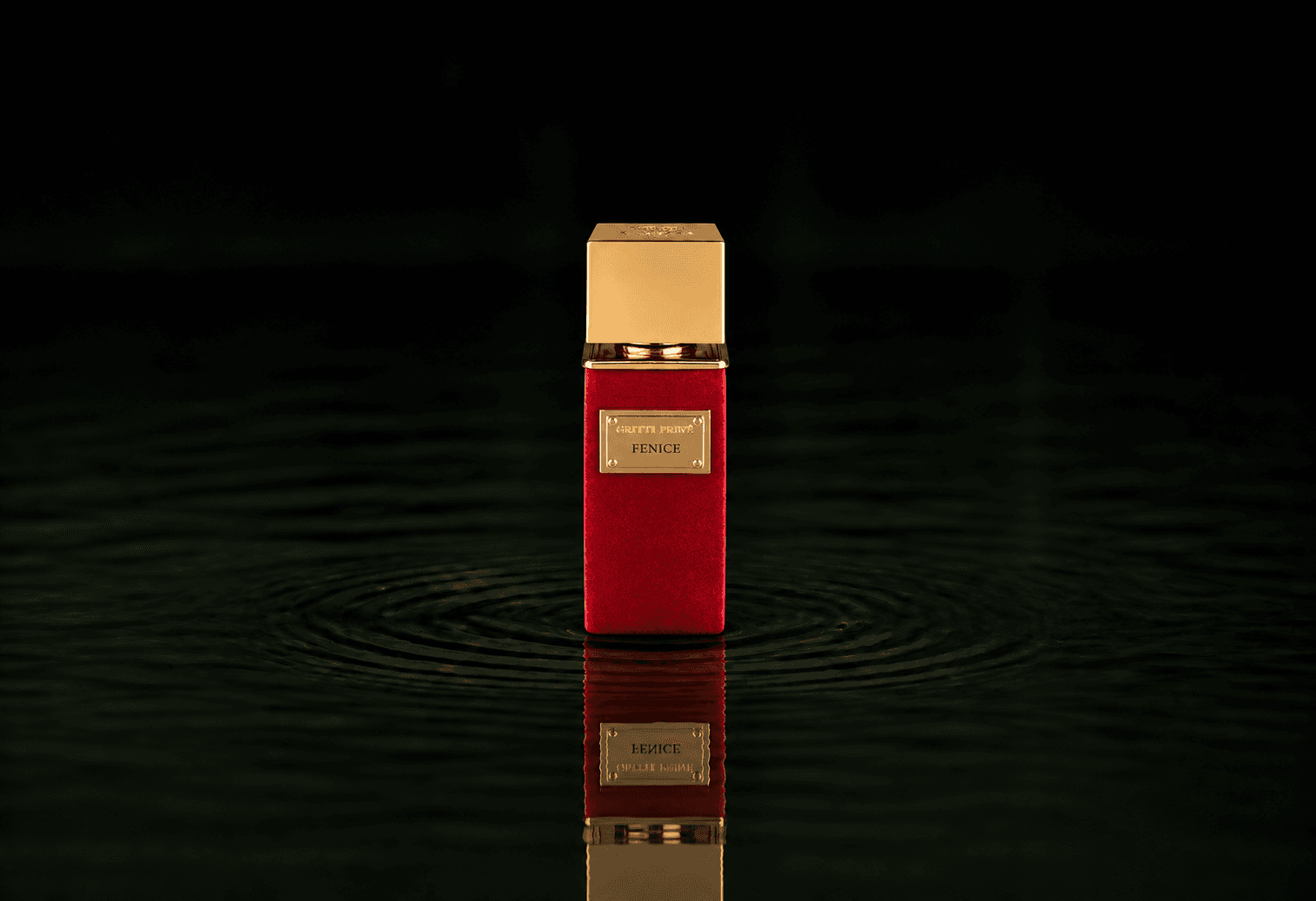 Gritti Fenice fragrance bottle floating above dark water